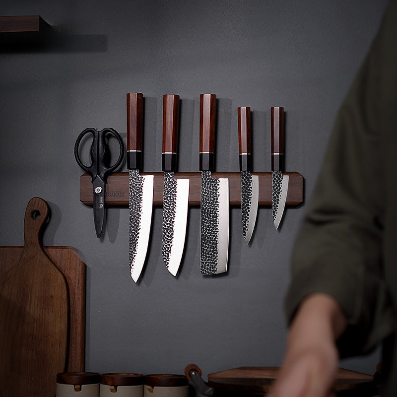 Knives mounted on wooden magnetic holder