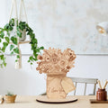 Handmade wooden vase ornament with dried flowers