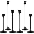 Black metal candelabra with lit candles
