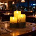 Set of three real-wax LED candles with remote