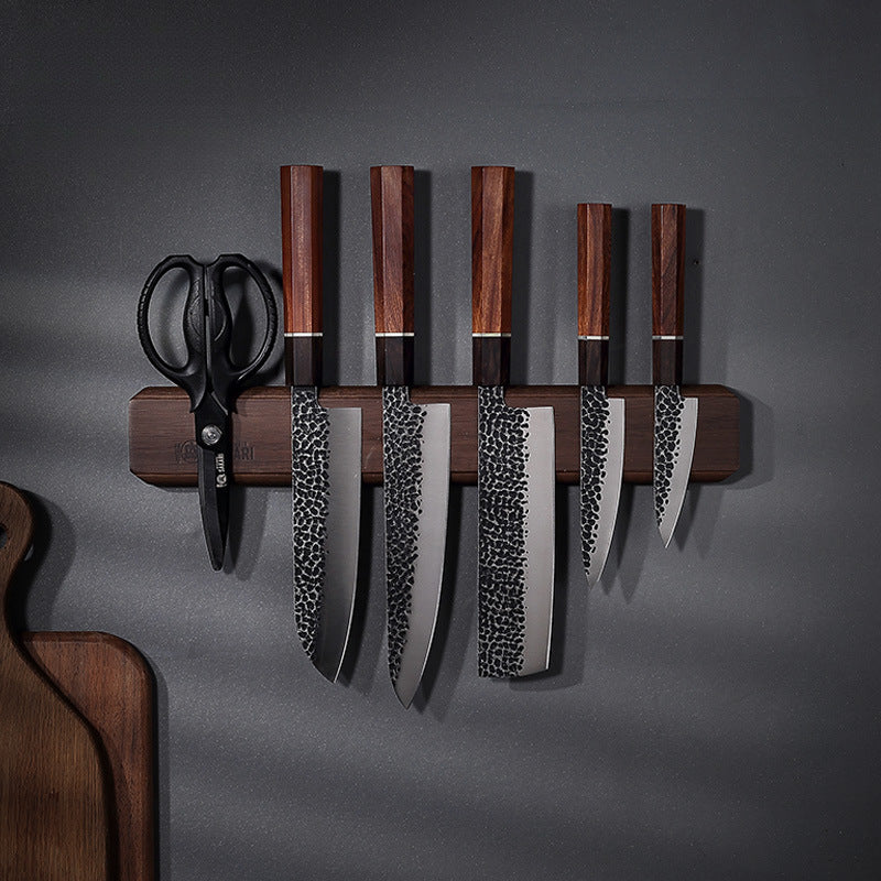 Knife collection on magnetic wooden holder